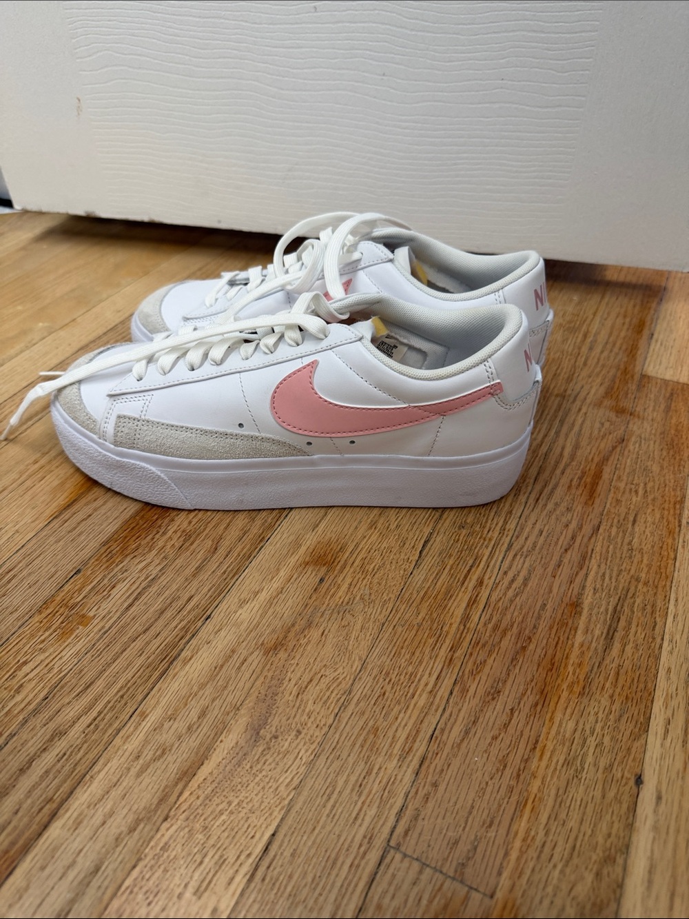 Nike Women's White Sneakers with Pink Swoosh and Cream Accents